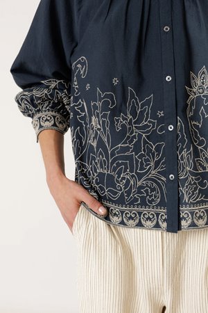 Indi & Cold  floral hem blouse back